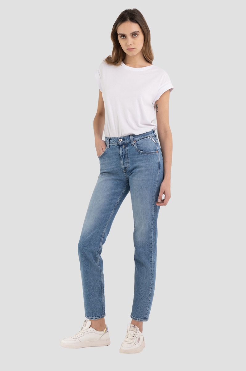 Woman in high-waisted jeans and a white bandeau top mockup